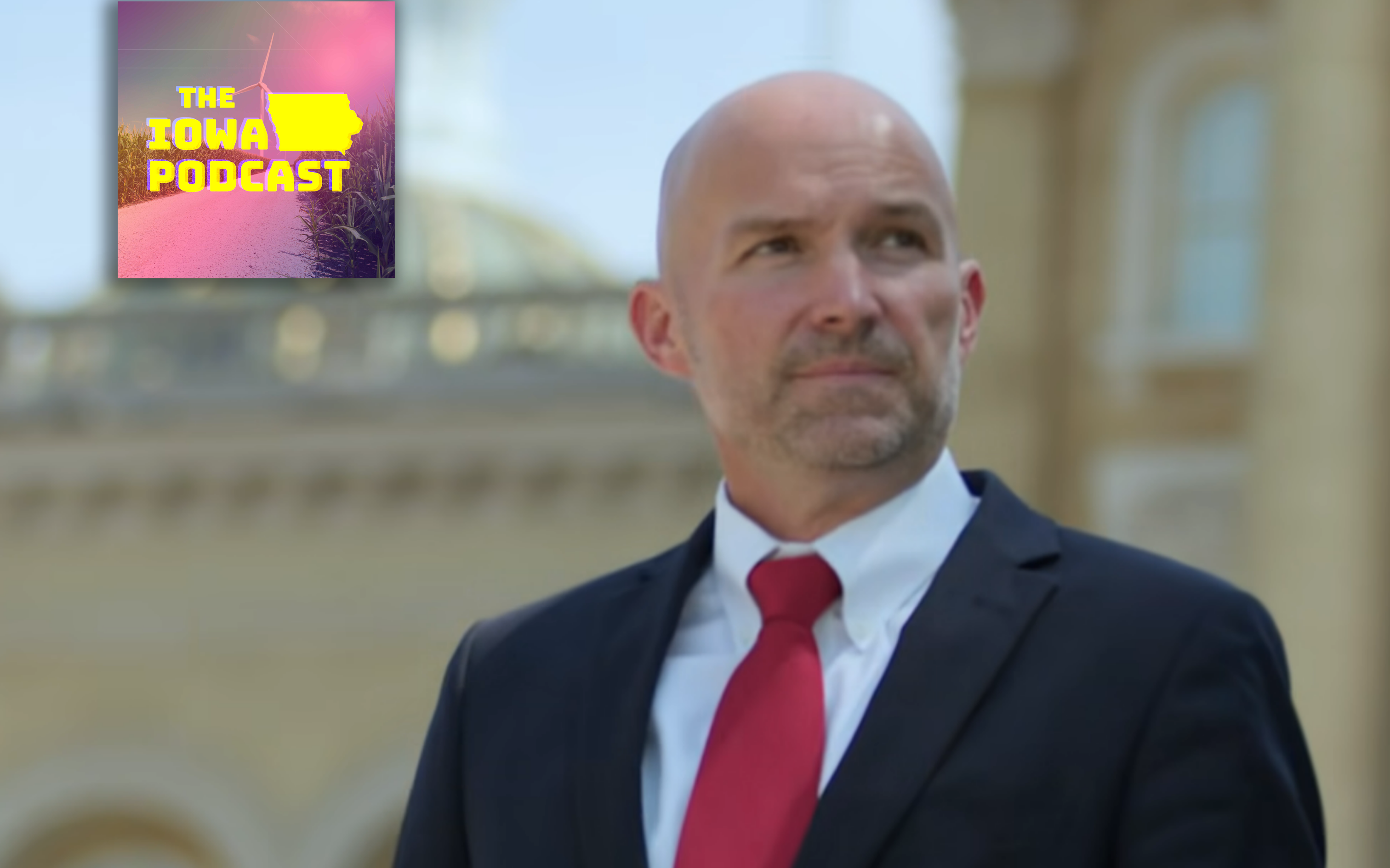 Adam Steen stands in front of Iowa Capitol